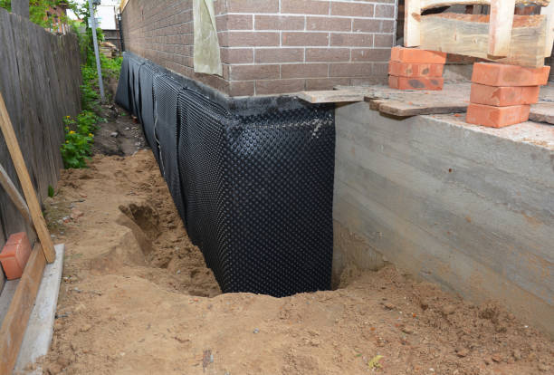 Happy homeowners after waterproofing job in Washington